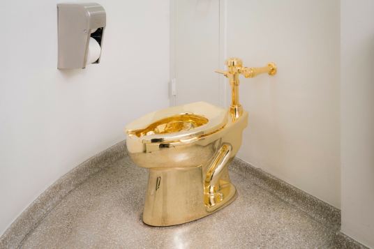 gold toilet by Maurizio Cattelan